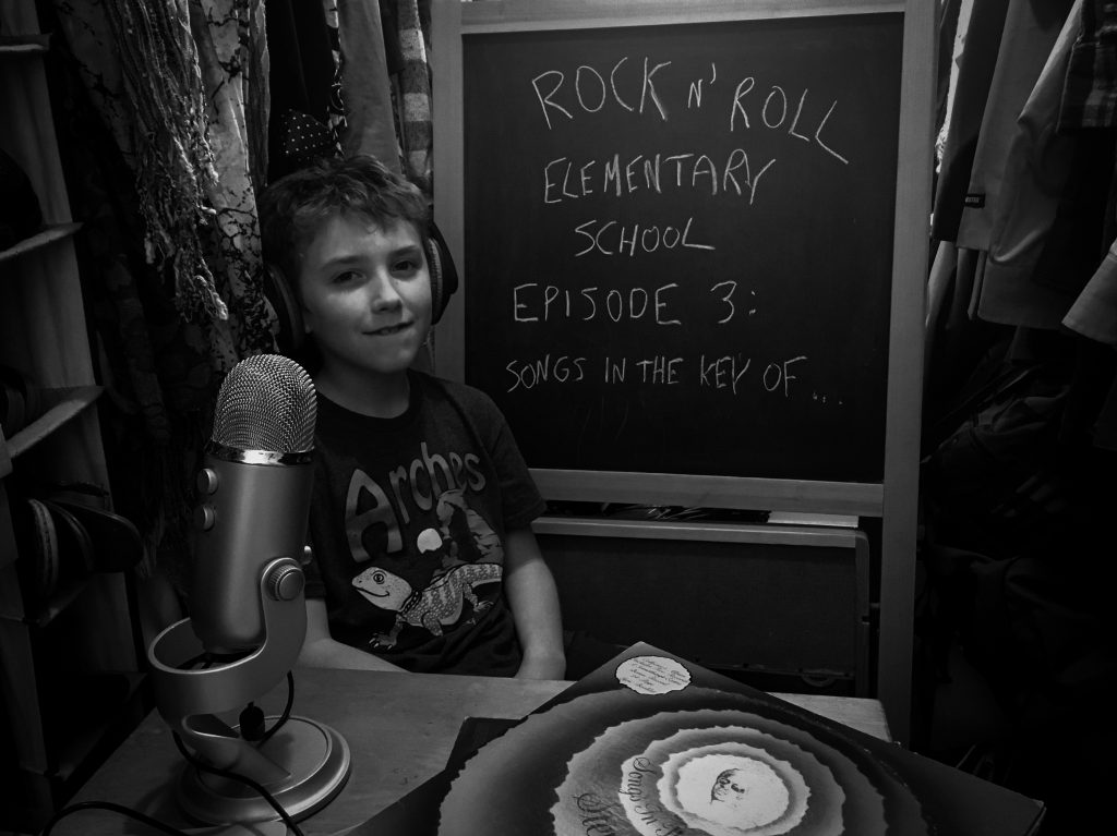 boy in closet with blackboard