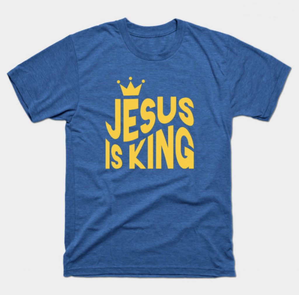 Jesus Is King yellow logo text on blue shirt