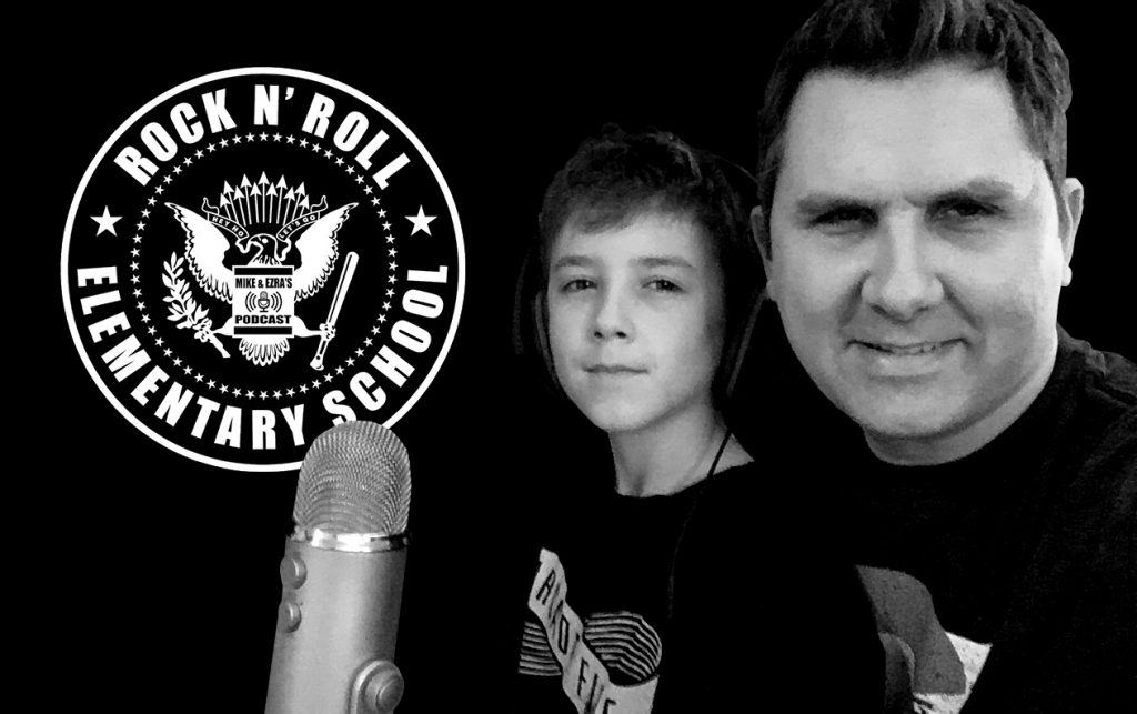 father and son with microphone and logo in black and white